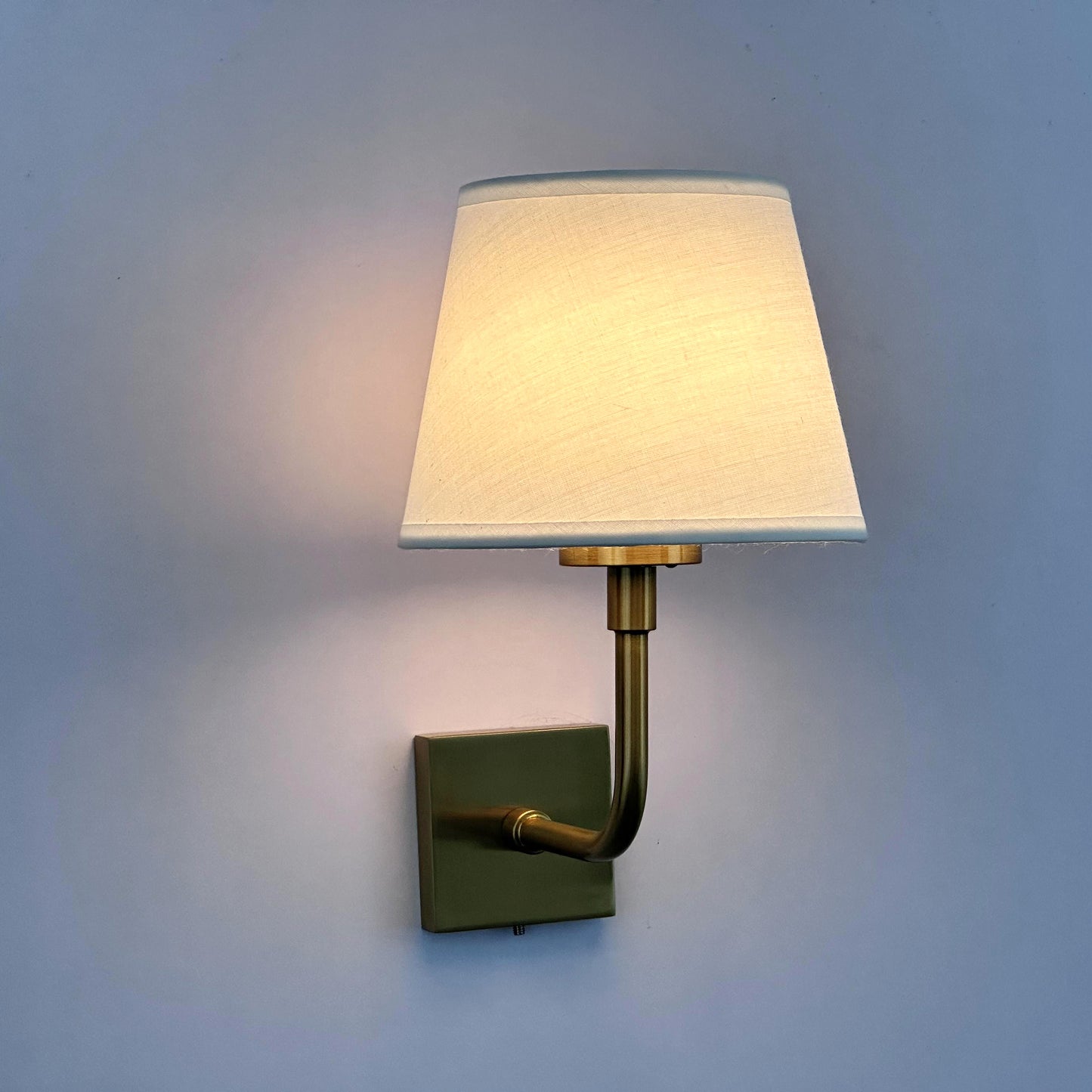 Iron wall lamp with fabric shade, gold-colored