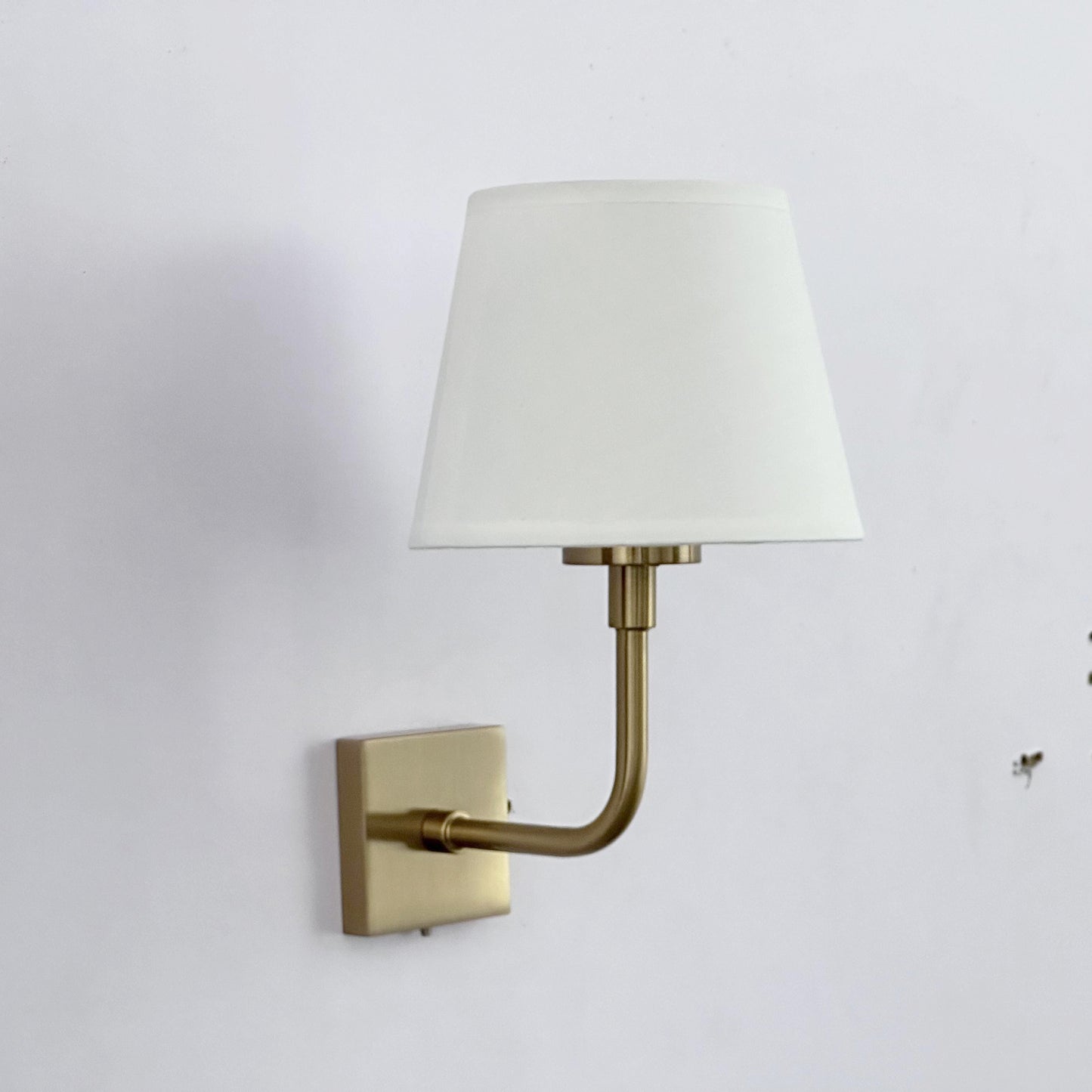 Iron wall lamp with fabric shade, gold-colored